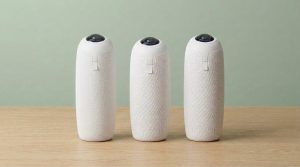 Three 360 meeting cameras on a light desk