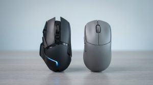 A dark gaming mouse with a blue accent next to a neutral gray productivity mouse on a light desk